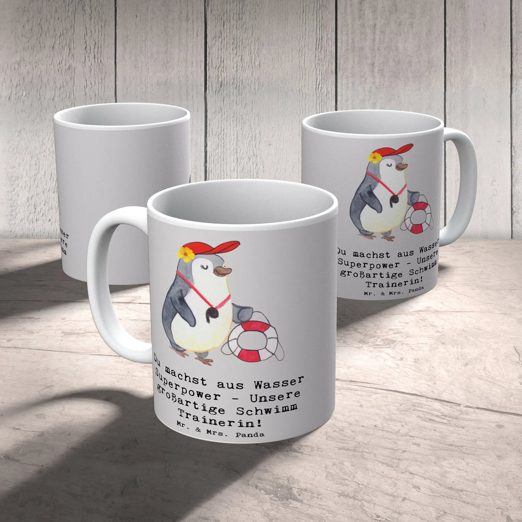 Mug Du machst aus Wasser Superpower - Unsere großartige Schwimm Trainerin! Tasse, Kaffeetasse, Teetasse, Becher, Kaffeebecher, Teebecher, Keramiktasse, Porzellantasse, Büro Tasse, Geschenk Tasse, Tasse Sprüche, Tasse Motive, Kaffeetassen, Tasse bedrucken, Designer Tasse, Cappuccino Tassen, Schöne Teetassen, Geschenk, Sport, Sportart, Hobby, Schenken, Danke, Dankeschön, Auszeichnung, Gewinn, Sportler